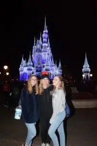 Jennifer with her family at Disney