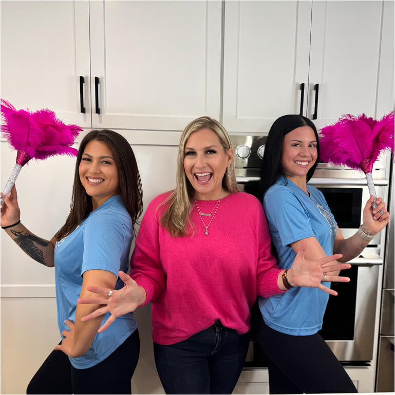 Two cleaning technicians smiling